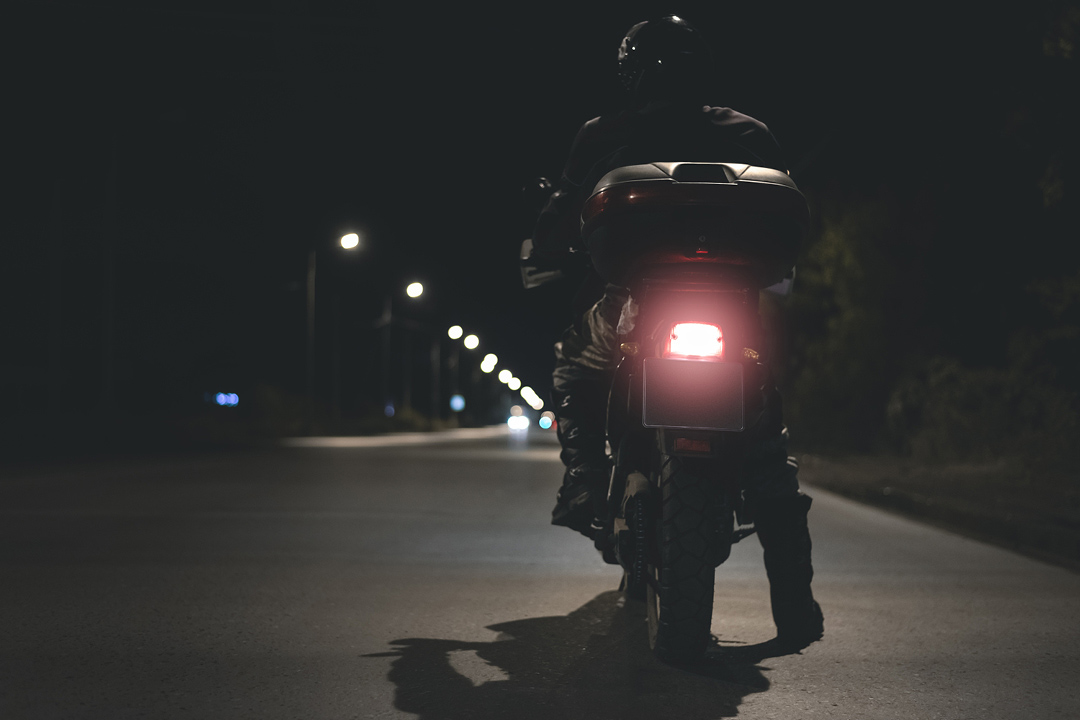 motorcycle rider at night